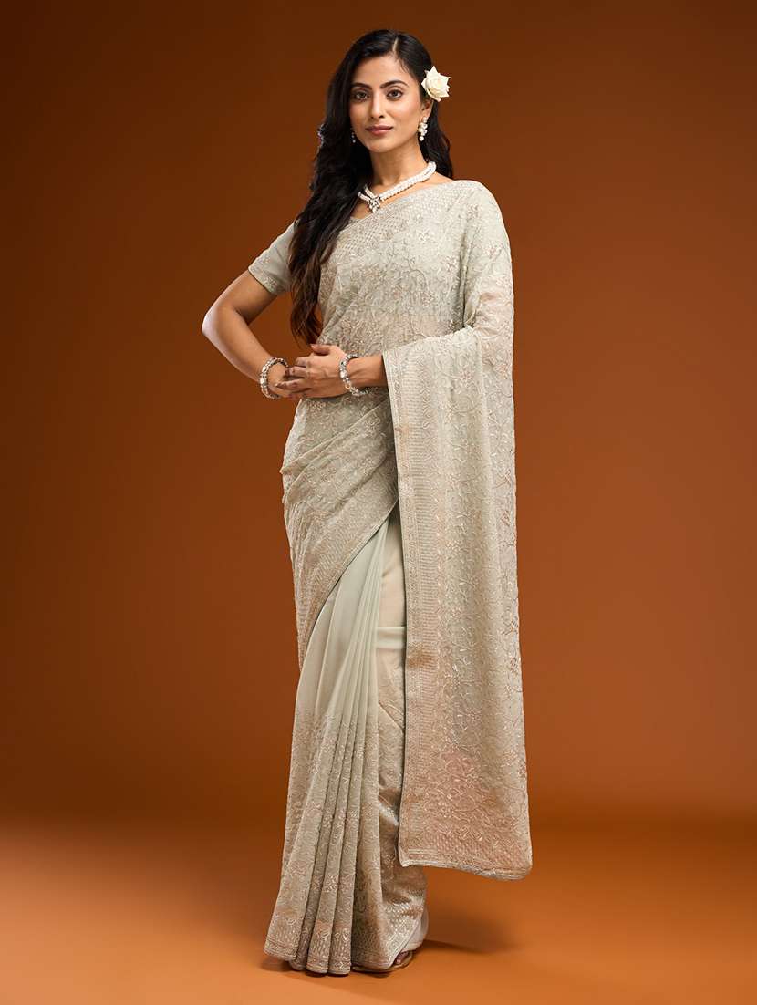 women solid with work embroidered saree with blouse