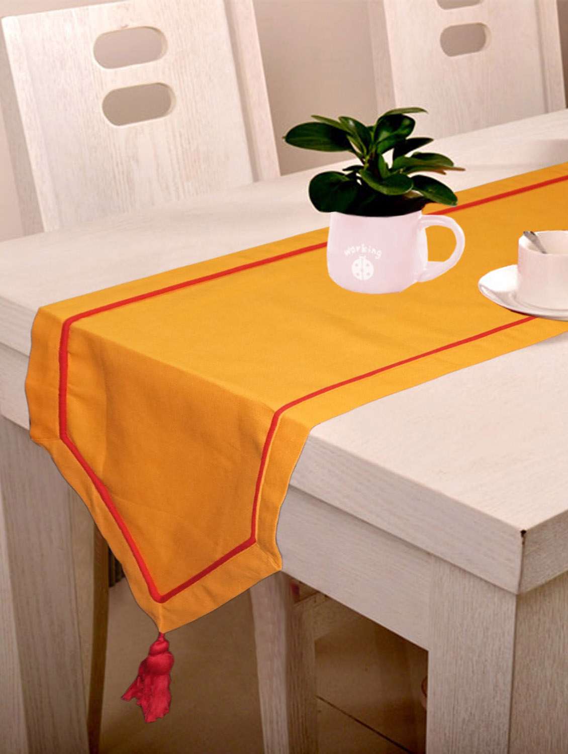 lushomes orange table runner with red contrasting cord piping