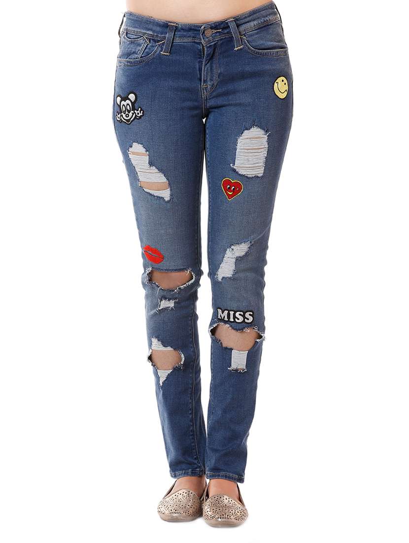 blue distressed denim jean with applique patch