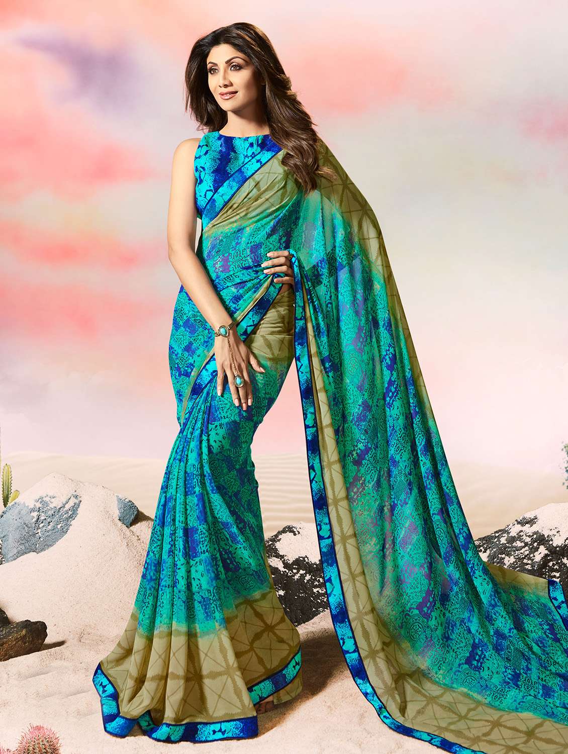 women's abstract turquoise colored saree with blouse