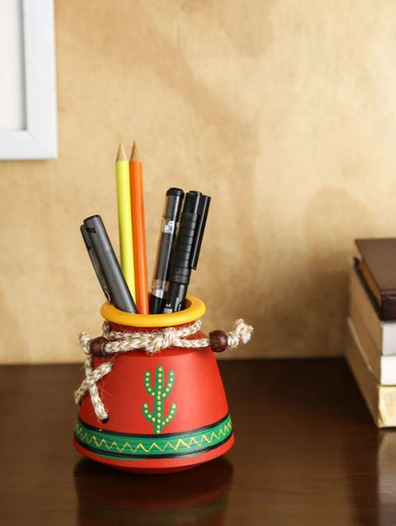 unravel india warli painted teracotta pen stand
