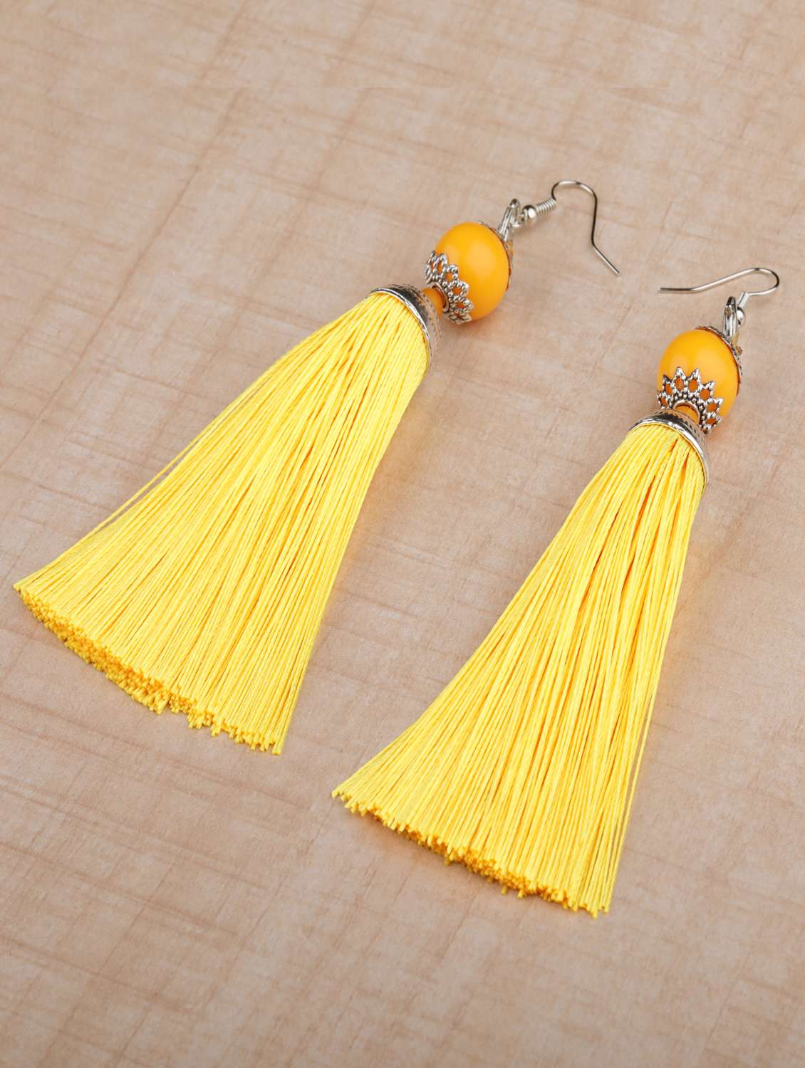 yellow metal drop earring
