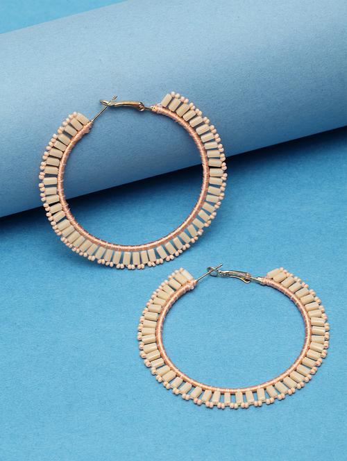 beige metal hoop earring - 17289359 -  Standard Image - 0