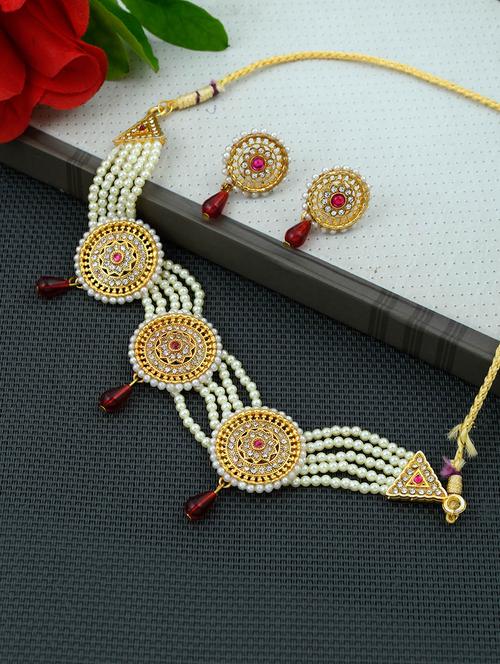 gold brass necklaces and earring - 17354642 -  Standard Image - 0