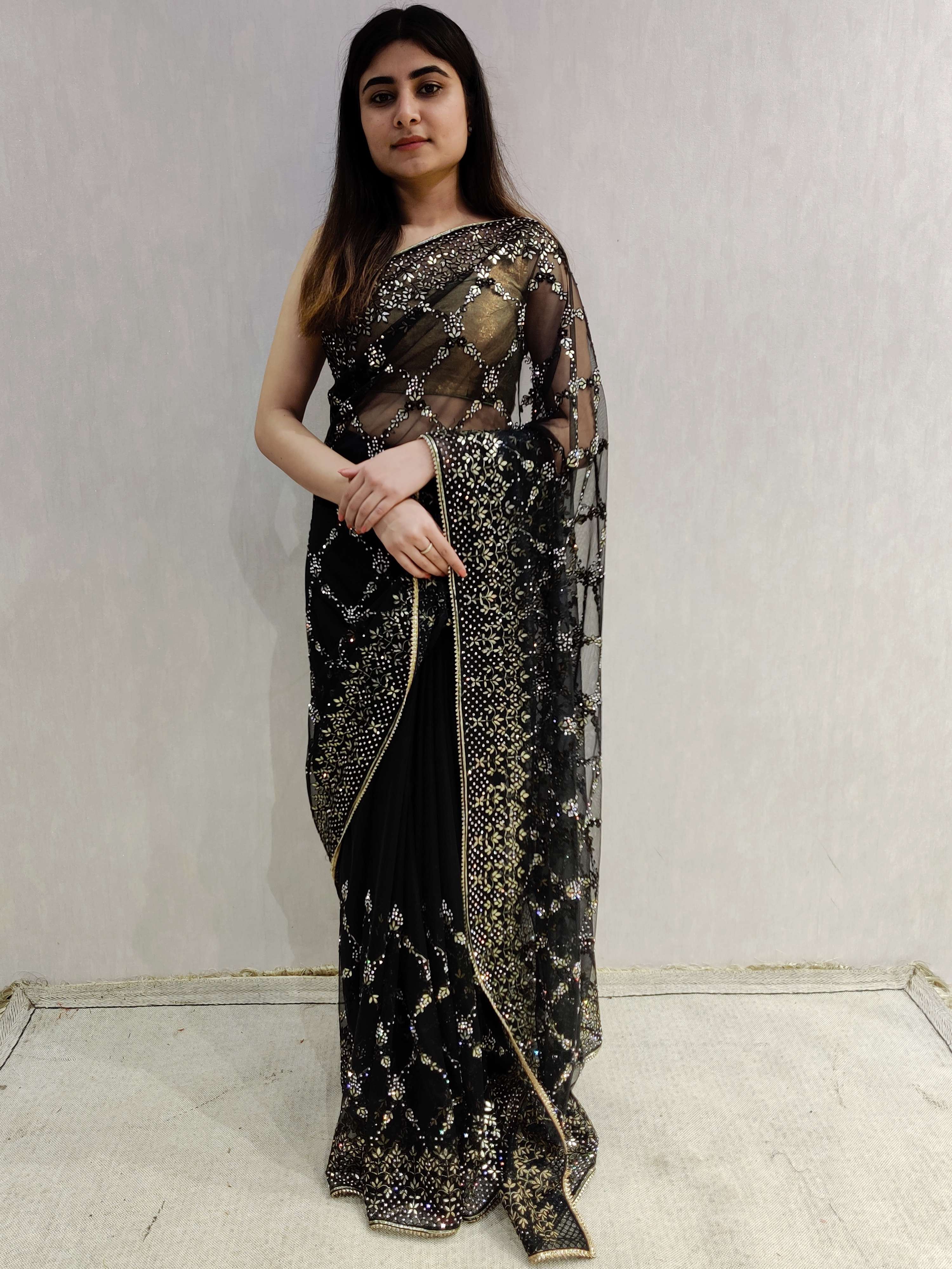 black net embroidered saree . 