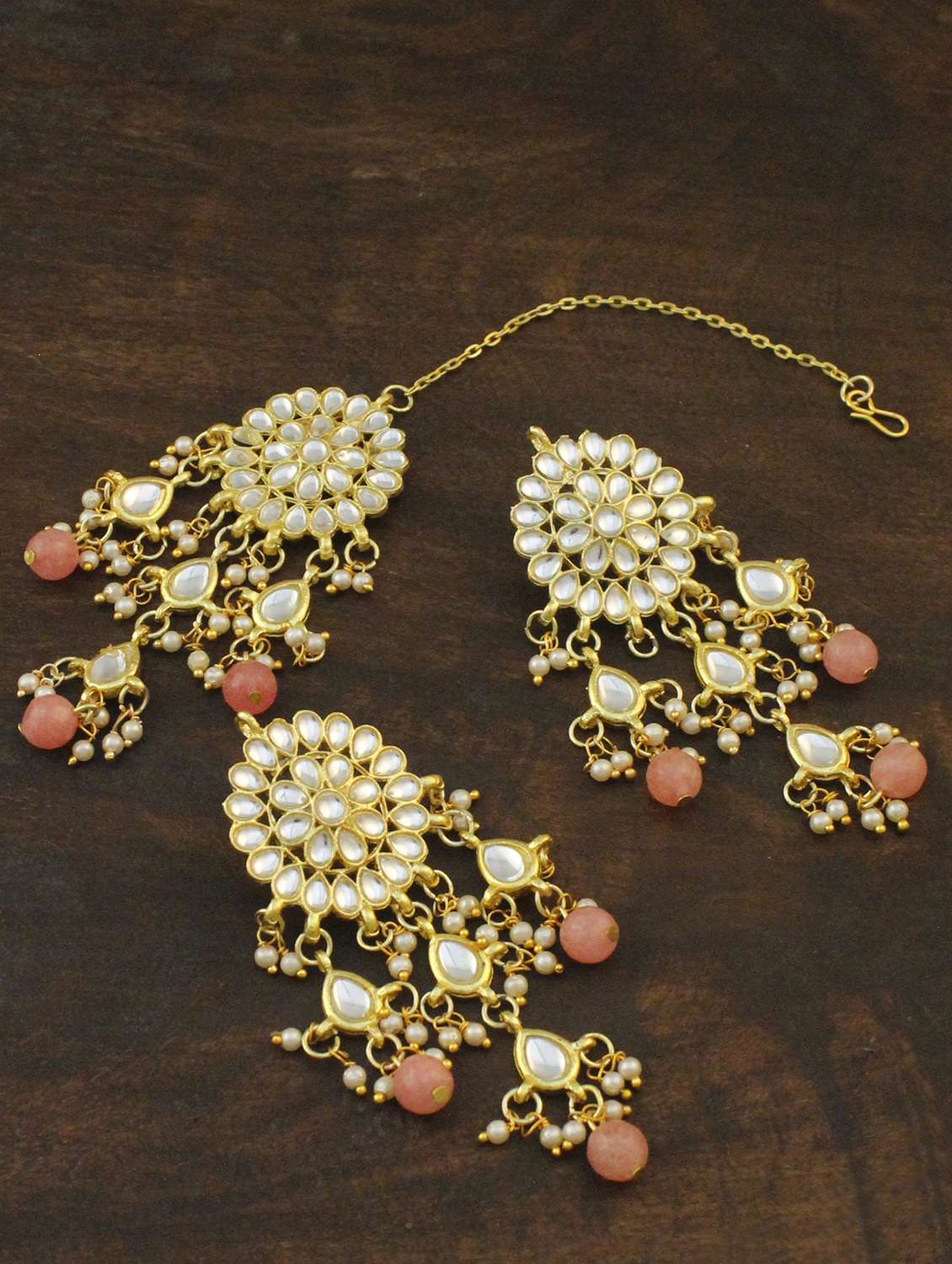orange metal earring and maang tikka set