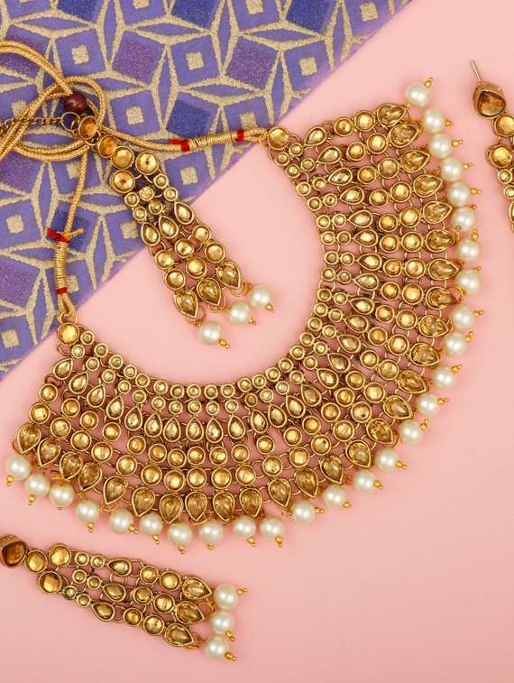gold brass choker necklaces with earring and maangtikka