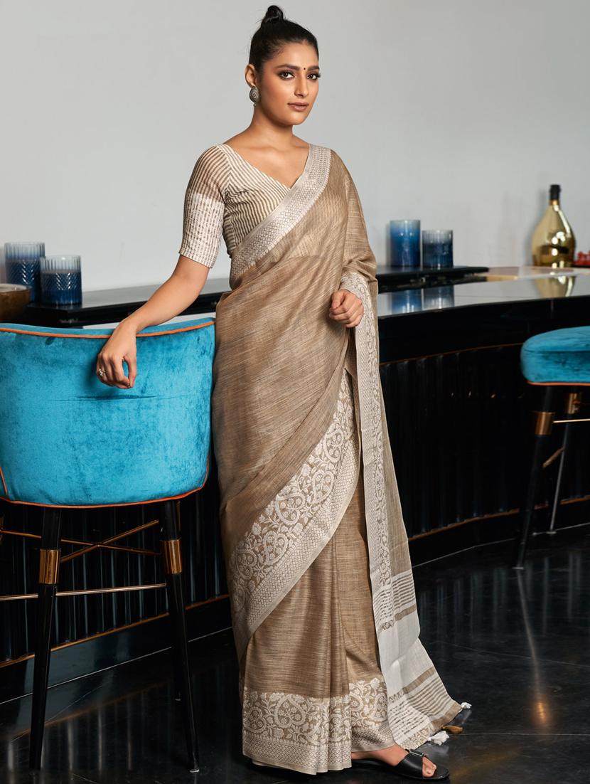 women's bordered beige colored saree with blouse