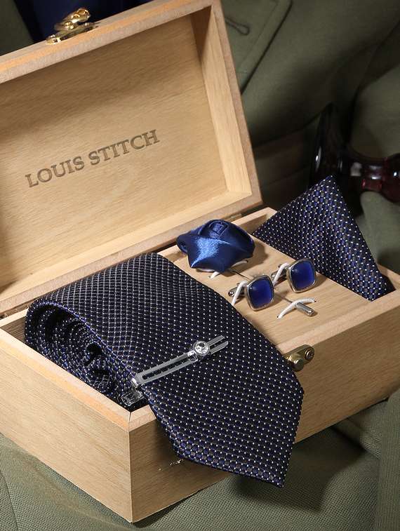 blue checkerd feel silk that is soft, rich in colour and beautiful to feel. the stitching thread are well finished. premium heavy quali interlining gets a perfect knot everytime. loved worldwide for sle ty