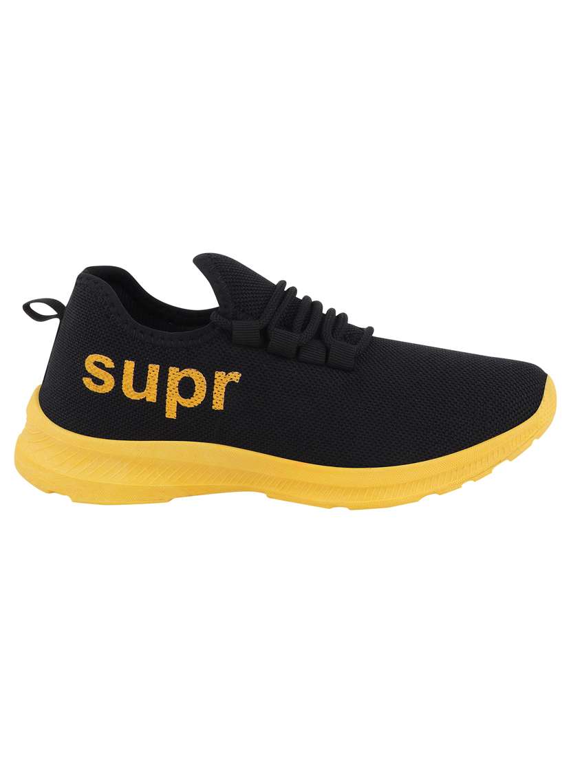 yellow canvas sport shoes - 18367398 -  Standard Image - 2