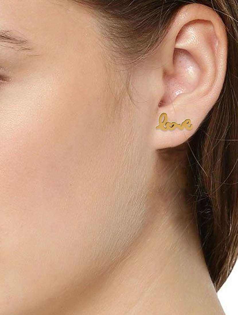 women golden stud earring - 18534394 -  Standard Image - 2