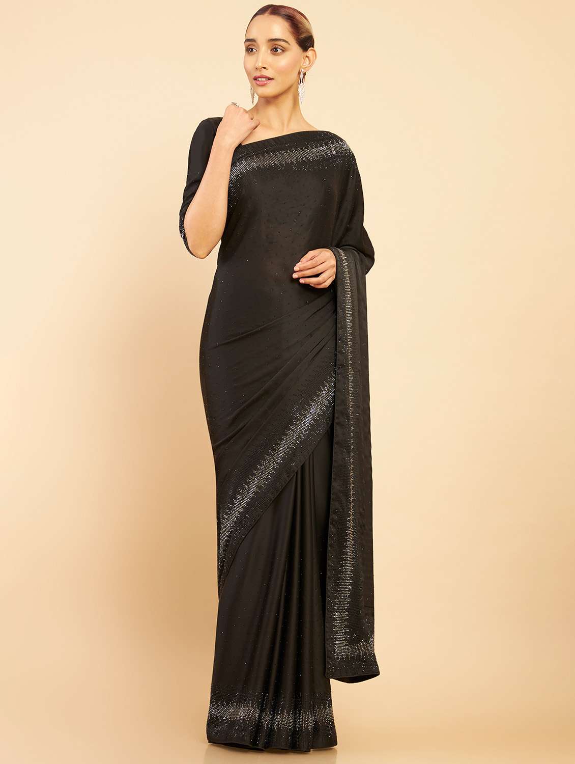 women's bordered black colored saree