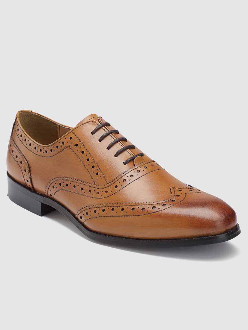 tan lace-up brouge shoes