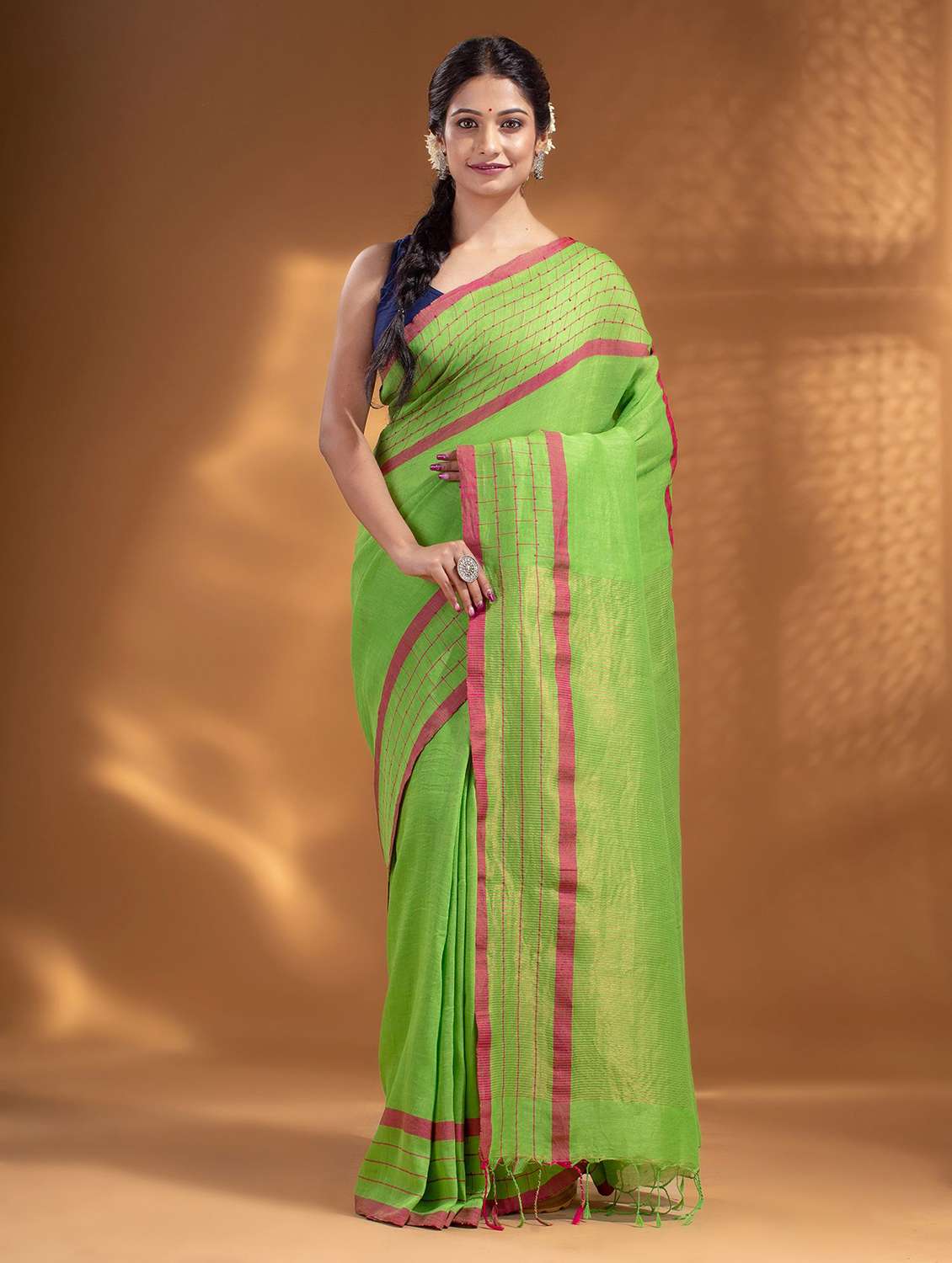 green self design woven saree with blouse
