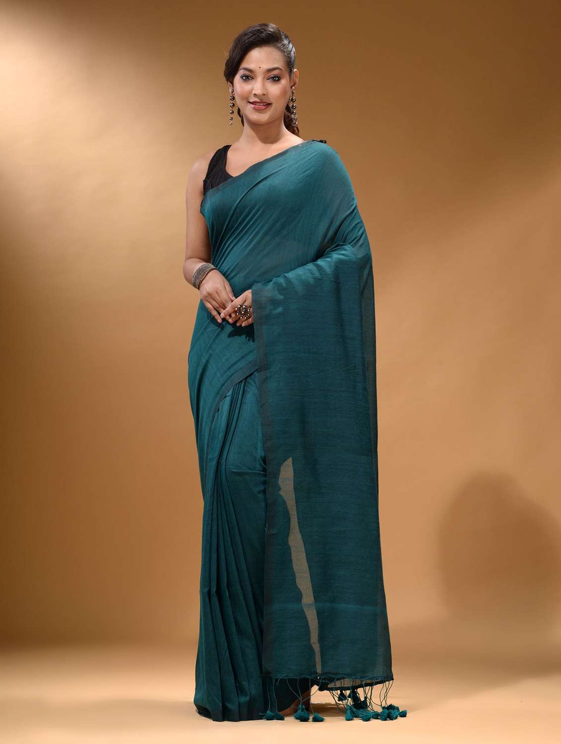 women's solid teal colored saree with blouse