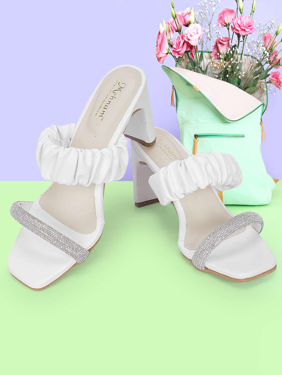 white synthetic slip on sandals