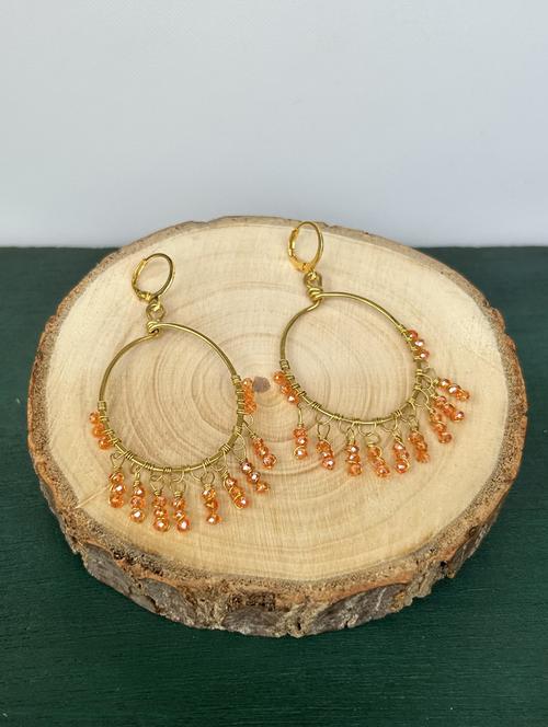orange brass hoop earrings - 20383778 - Standard Image - 0