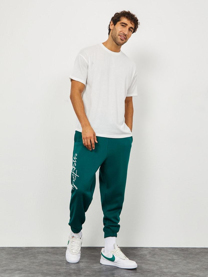 men mid rise placement printed jogger track pant - 20488820 - Standard Image - 2