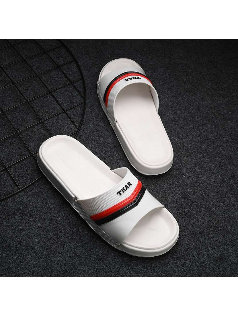 white synthetic slip on flip flops