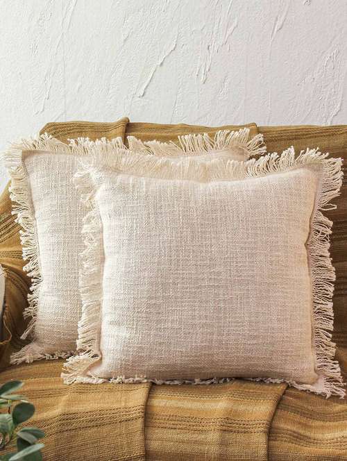 cream color textured  cotton cushion covers  - 21228917 -  Standard Image - 0