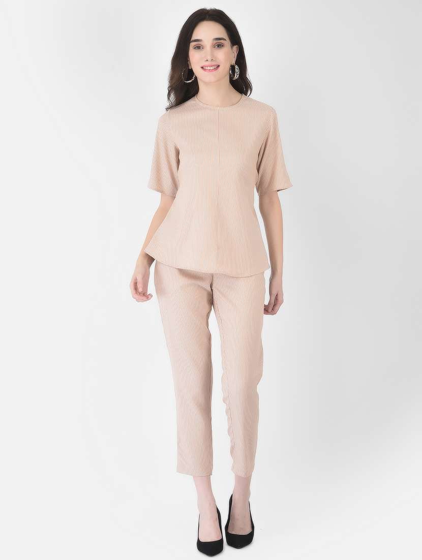 women beige top and trouser set co-ord