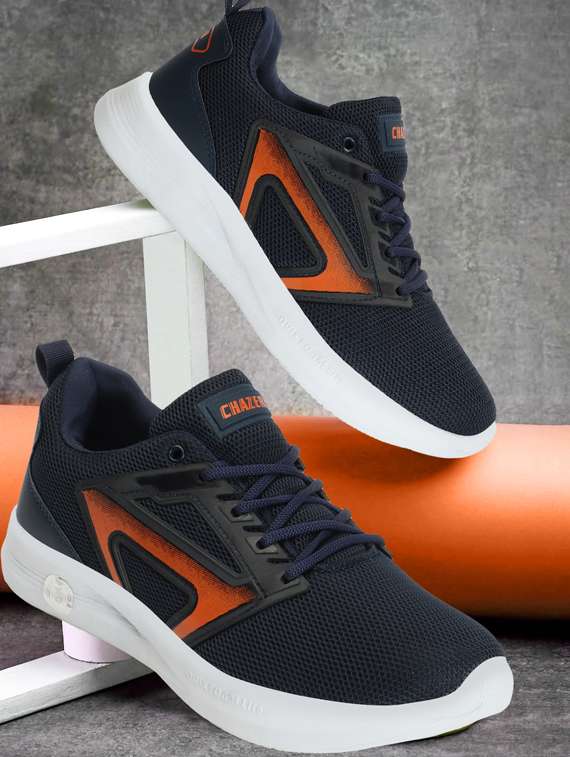 men lace up sports shoes