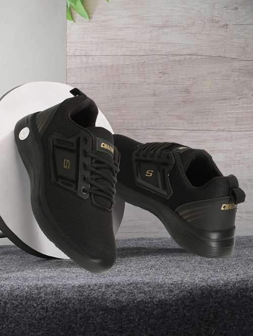men lace up sports shoes