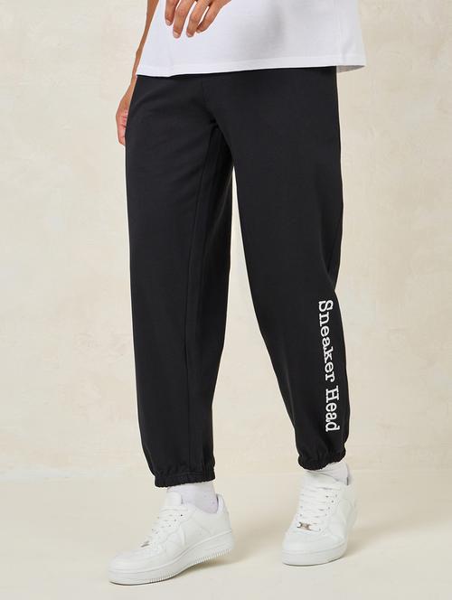 men balck placement print mid rise jogger - 21307617 - Standard Image - 0