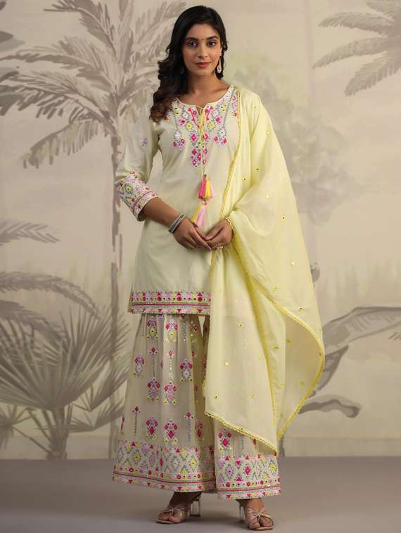 women yellow kurta sharara set with dupatta
