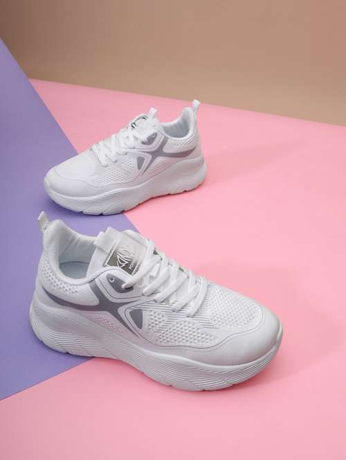 white lace-up sports shoes
