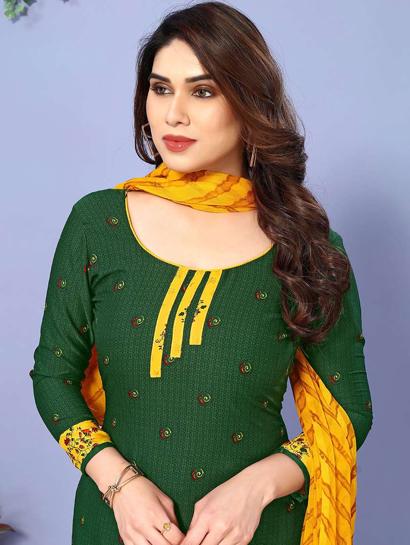 women green and yellow unstitched suit - 21447479 -  Standard Image - 2