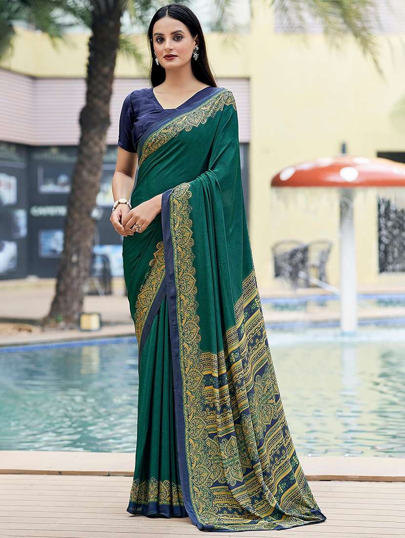 women green printed bordered saree