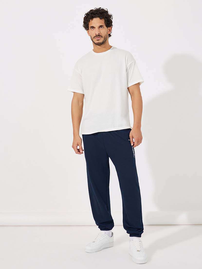 men mid rise placement print joggers - 21643846 - Standard Image - 2