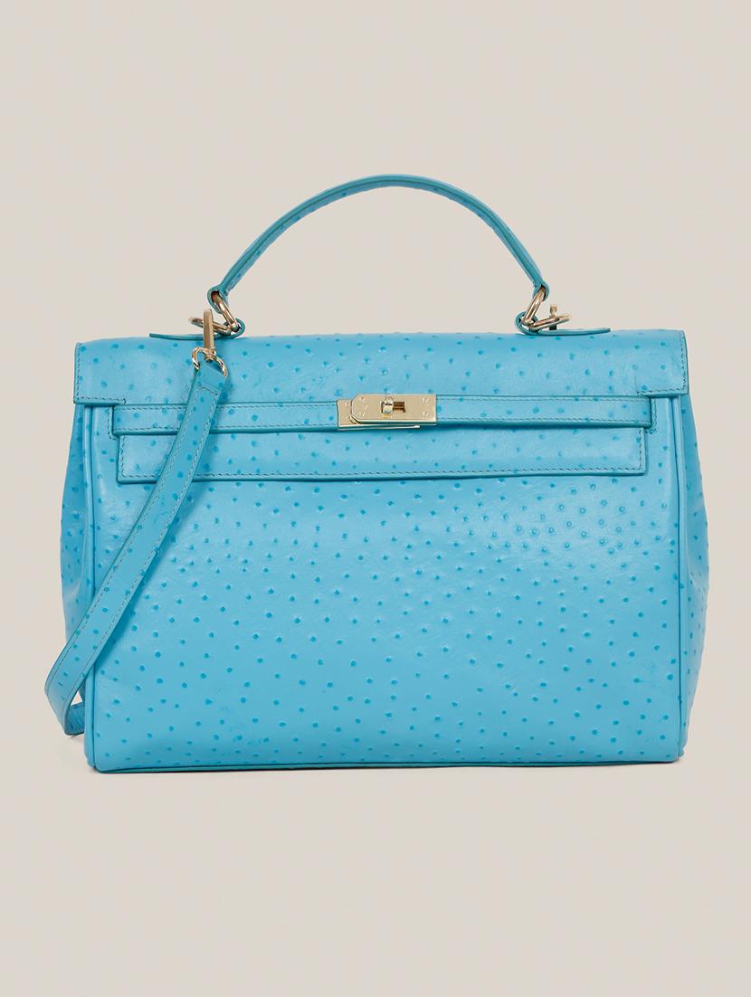 women blue textured leather handbag