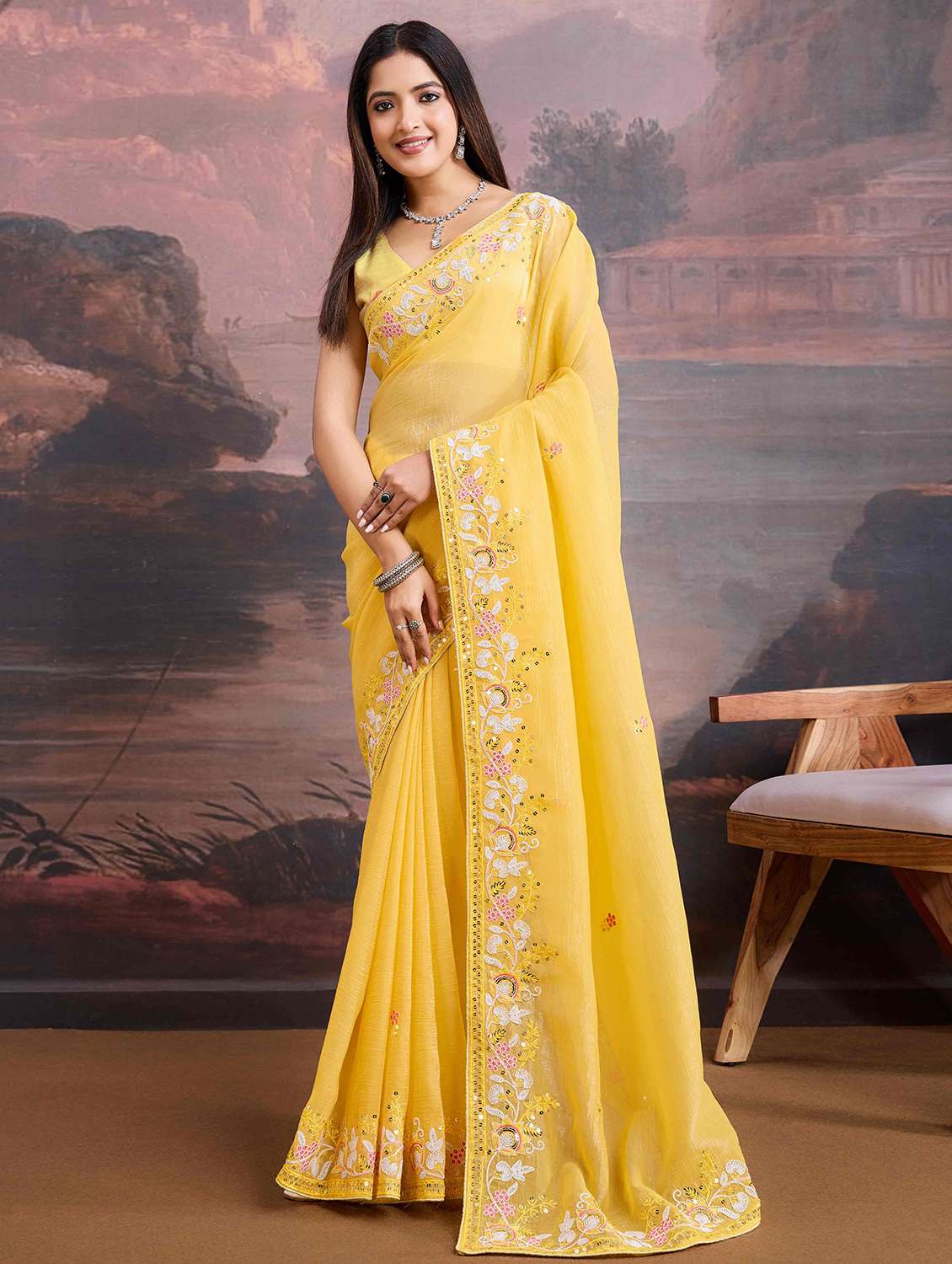 women yellow embroidered saree with blouse