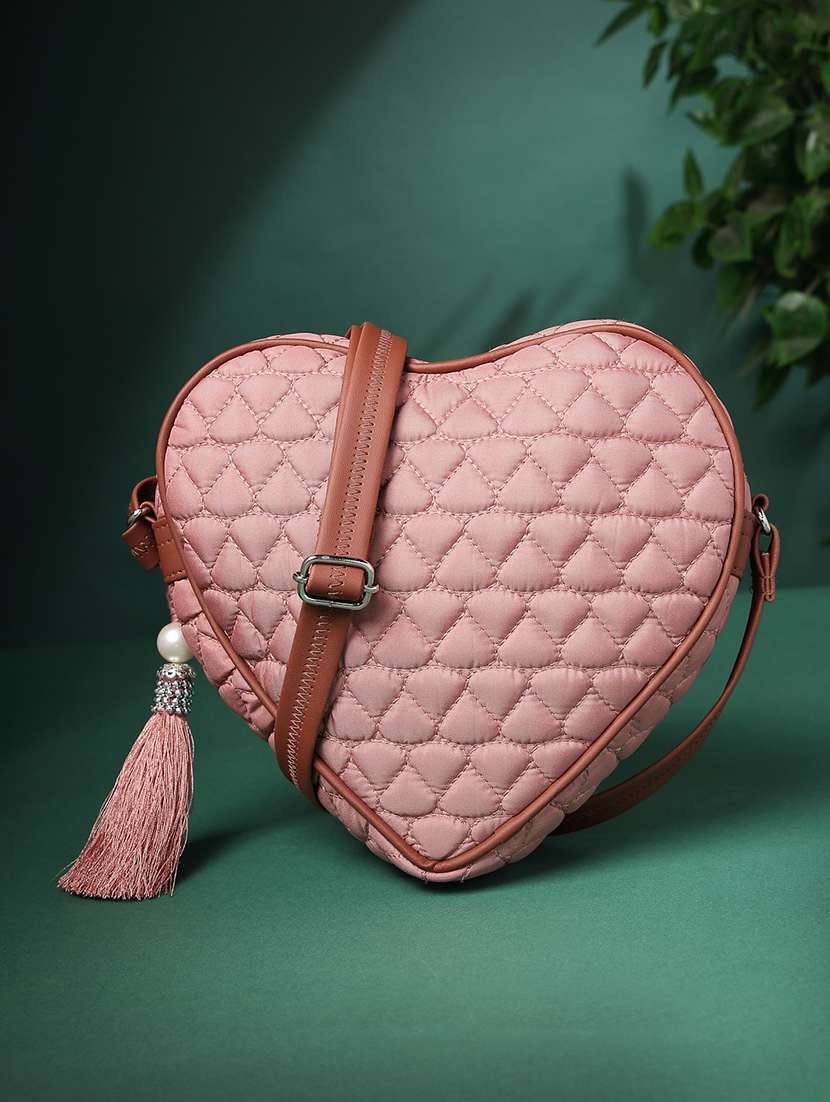 women solid quilted heart shape sling bag