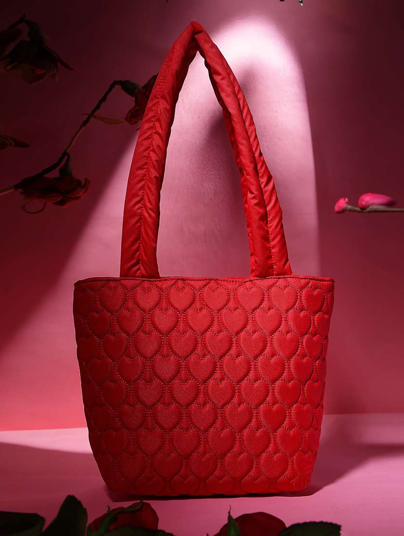 women red solid quilted handbag