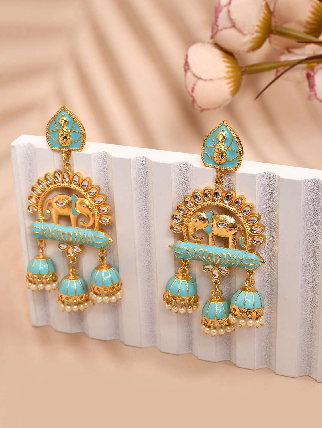 gold-plated animal shaped kundan drop earrings