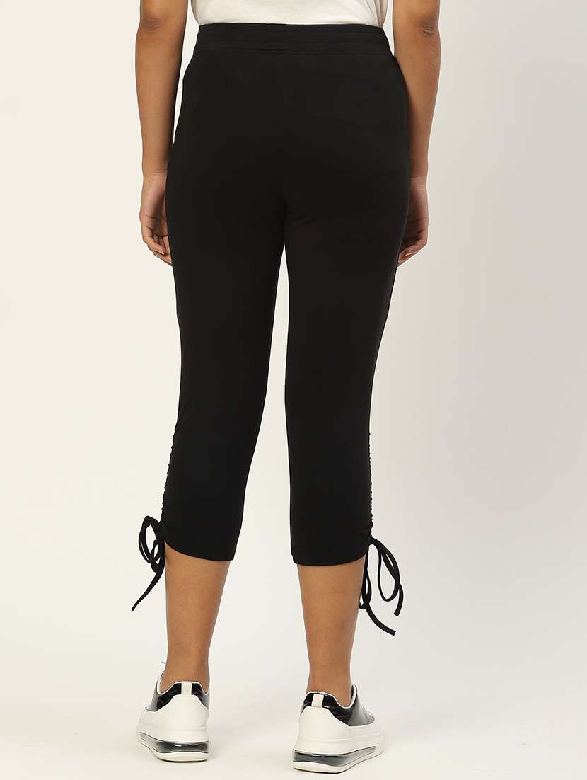 women solid mid rise slim fit capri