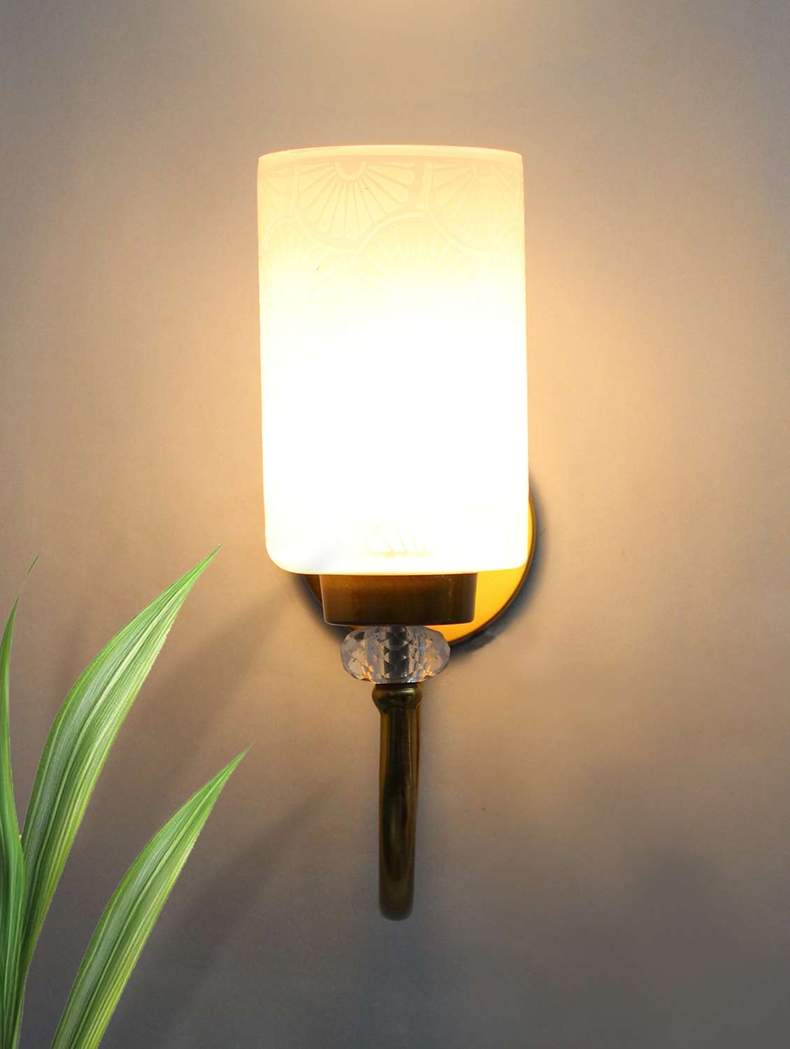 elegant golden finish wall sconce with floral design glass