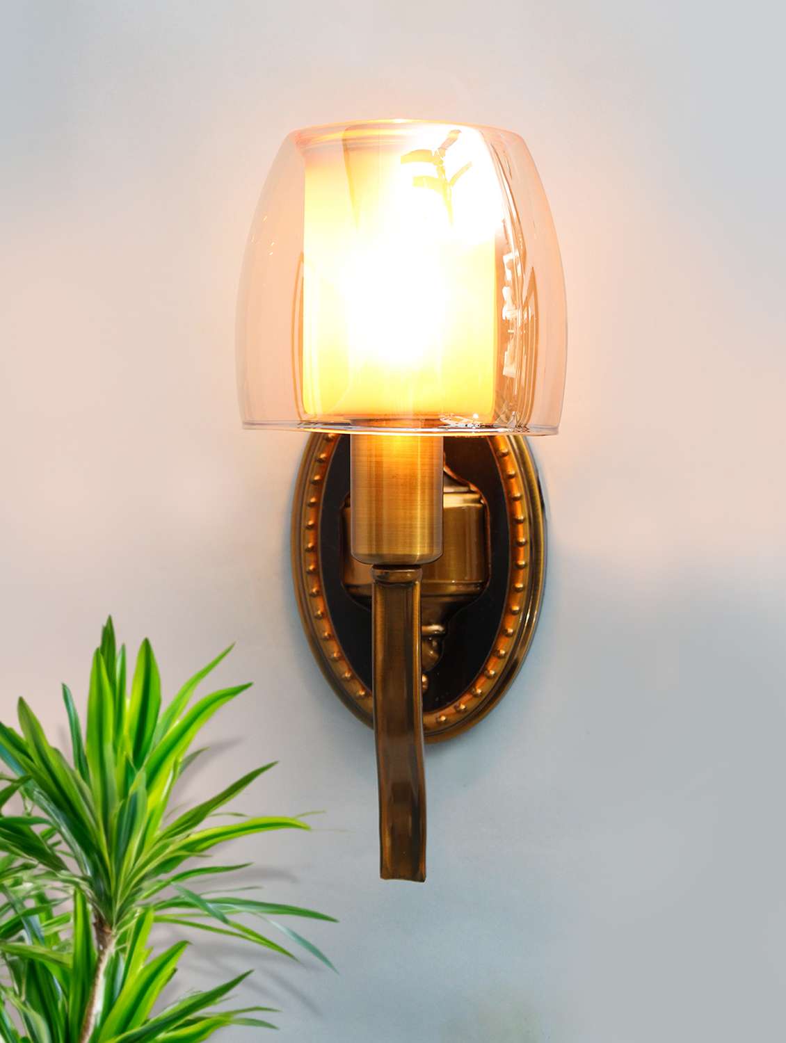 decorative vintage brass wall sconce with amber glass