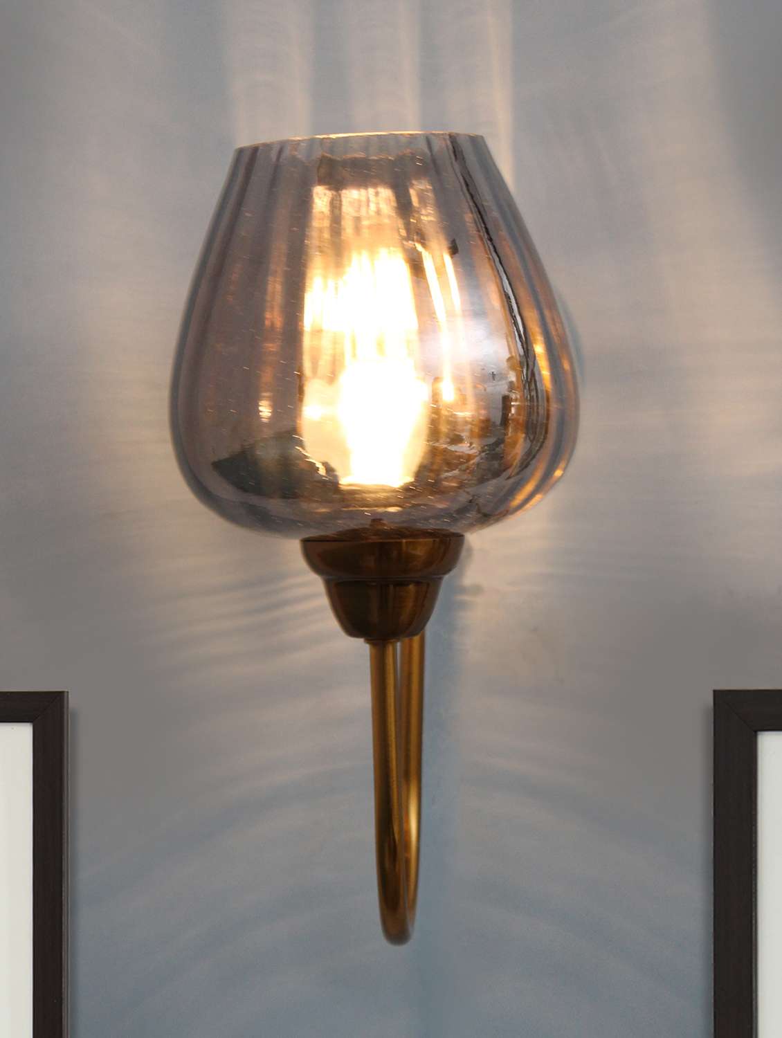modern gold finish wall sconce with ribbed smoked glass