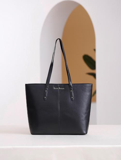 women black solid handbag - 21768093 -  Standard Image - 0