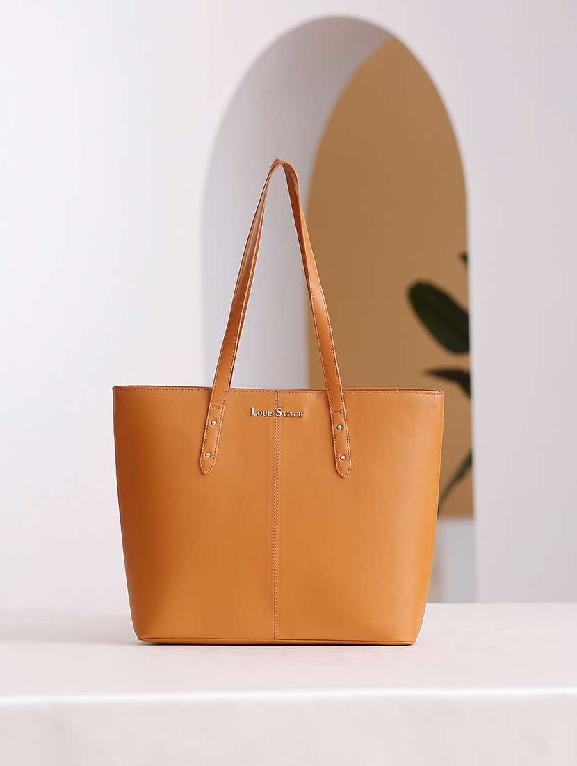 women tan solid handbag