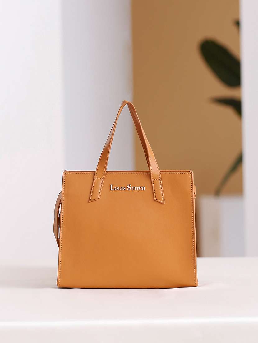women tan solid handbag