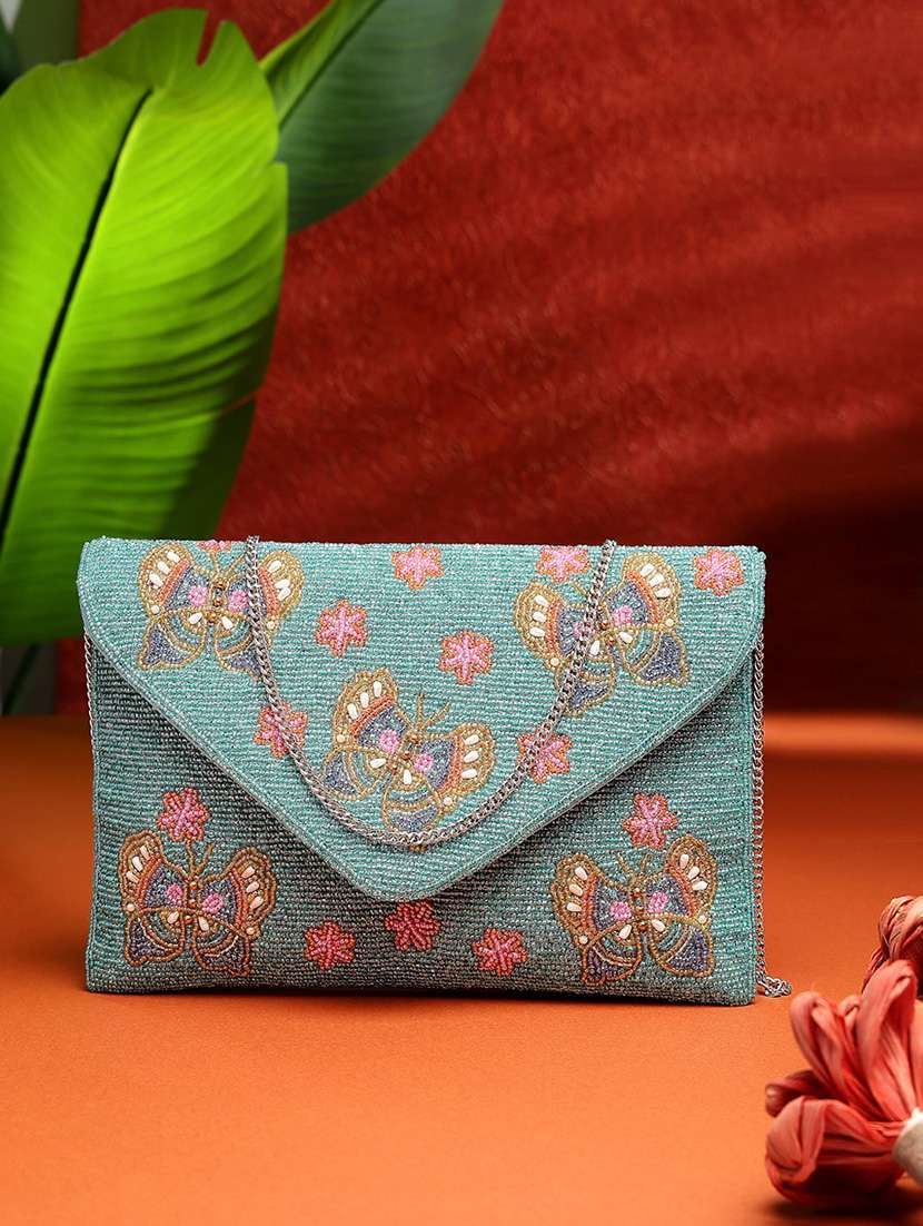 women turquoise embellished sling bag