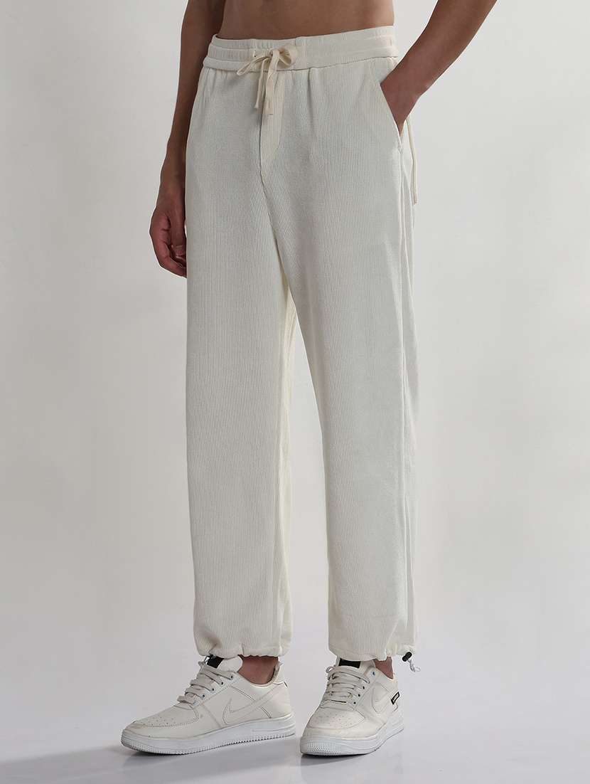men cream solid low rise relaxed fit jogger - 21933715 -  Standard Image - 2