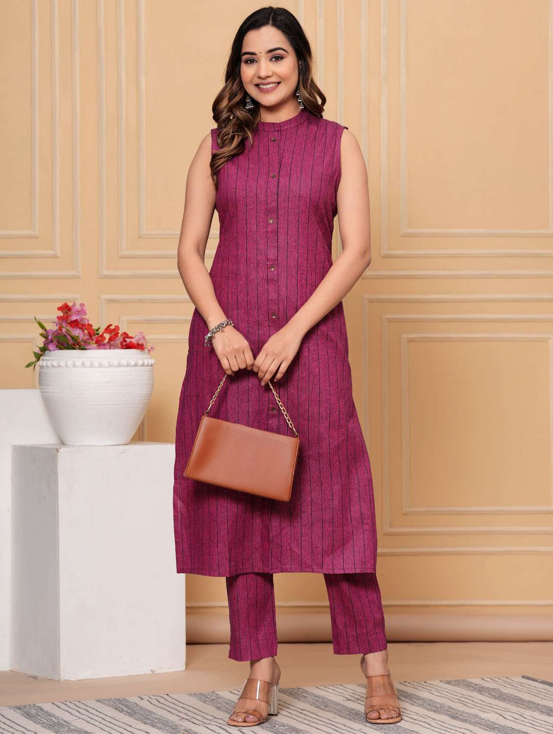 women striped sleeveless kurta pant set