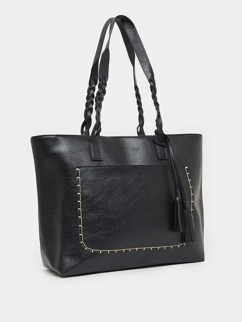women black textured tote bag with tassels