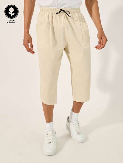 men cream solid mid rise three - fourth shorts - 21971516 - Standard Image - 0